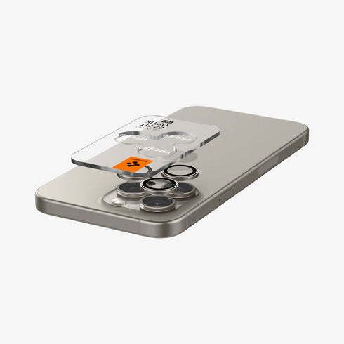 AGL07163 - iPhone 15 Pro / 15 Pro Max Optik Pro Lens Protector in natural titanium showing the device